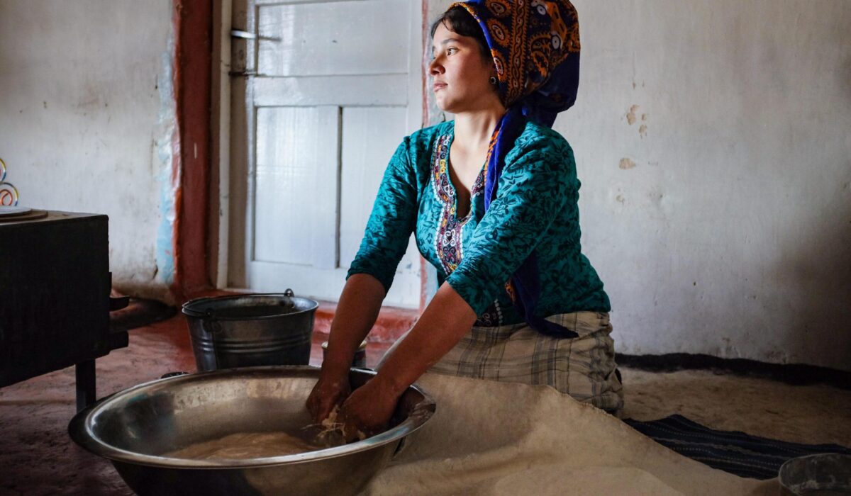 Cara Kerven, In the Gara Gum desert of Turkmenistan, a newly married women
kneads bread for her husband’s family. After letting the dough rise,
she will take it outside to the clay oven (tamdyr) and secure the loaves
to the hot walls inside. The tedious process of cleaning the baked
loaves is shared between her and her husband’s brother’s wives (elti).
She wears the appropriate silk scarf (gýnaç) of a married women and, when in the presence of older men, secures a portion of the scarf in her mouth (ýaşmak).