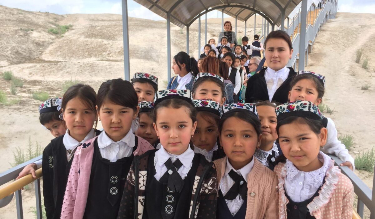 Farit Gabdulhakov, Uzbekistan, 2019, School children from the city of Namangan on an excursion to the
ancient city of Akhsikent. Destroyed by an earthquake in 1622,
Akhsikent was a city with well-developed metallurgy. Swords produced there were widely sold all over the region, including in the famous markets in Damascus. After the earthquake, Namangan was founded by a surviving resident of Akhsikent.