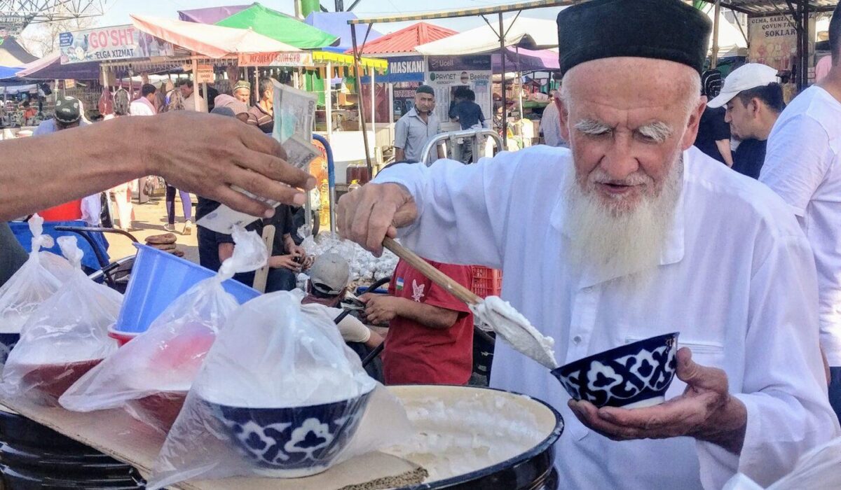 Rashid Gabdulhakov, Uzbekistan, 2019, 
An old man from the fairytale ‘1001 nights’ at Chorsu bazaar in the
centre of Namangan. He is captured here selling “misholda” – a local
marshmallow-like sweet substance served during the holy month of
Ramadan.