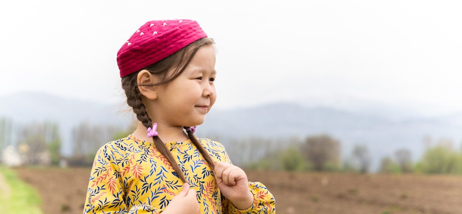 girl in a national headdress. Spring, Nowruz holiday. Kazakh girl. Central Asia, Kazakhstan.