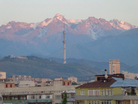 Almaty city landscape with mountains, houses and a TV tower