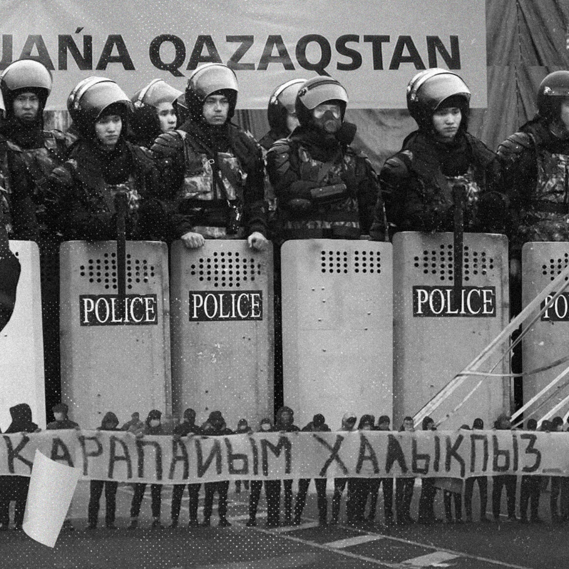 Fully equipped police above a row of peaceful protesters holding a banner: We are ordinary citizens, not terrorists